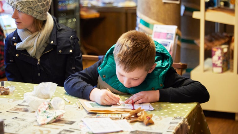 Visitors enjoying Christmas crafts at Lyme, Cheshire